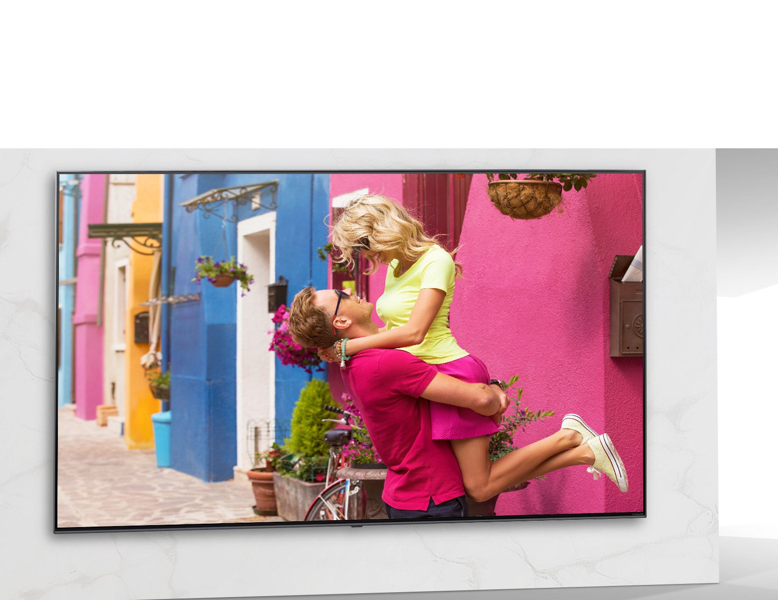 TV screen showing the scene of colorful romance movie with men and women hugging.