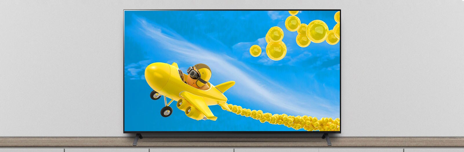 The TV is on the stand, and the screen shows an animation of an airplane flying through it.