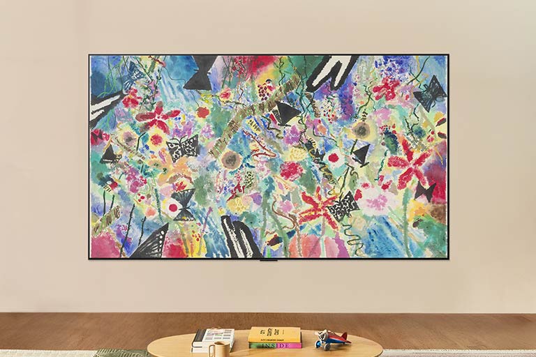 A wall-mounted LG TV looks powered down, but the Always Ready feature turns on. It shows information and then cycles through different artworks.