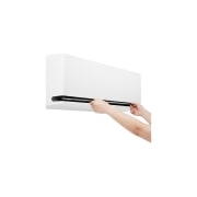 LG DUALCOOL AI 1.5 Ton Split Air Conditioner with Dual Inverter, Dual Vane, Soft Air , Ionizer , and Energy Saving&nbsp;, Hands opening the lower vane of an LG air conditioner for cleaning or maintenance, AIR-19T4W, thumbnail 14