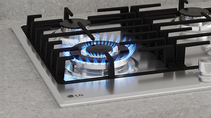 Black gas cooktop with blue flame and flame-failure safety that automatically shuts off gas.