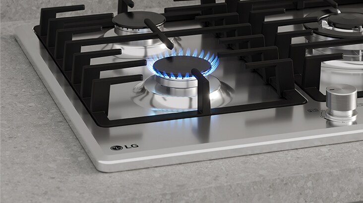 Black gas cooktop with blue flame and flame-failure safety that automatically shuts off gas.