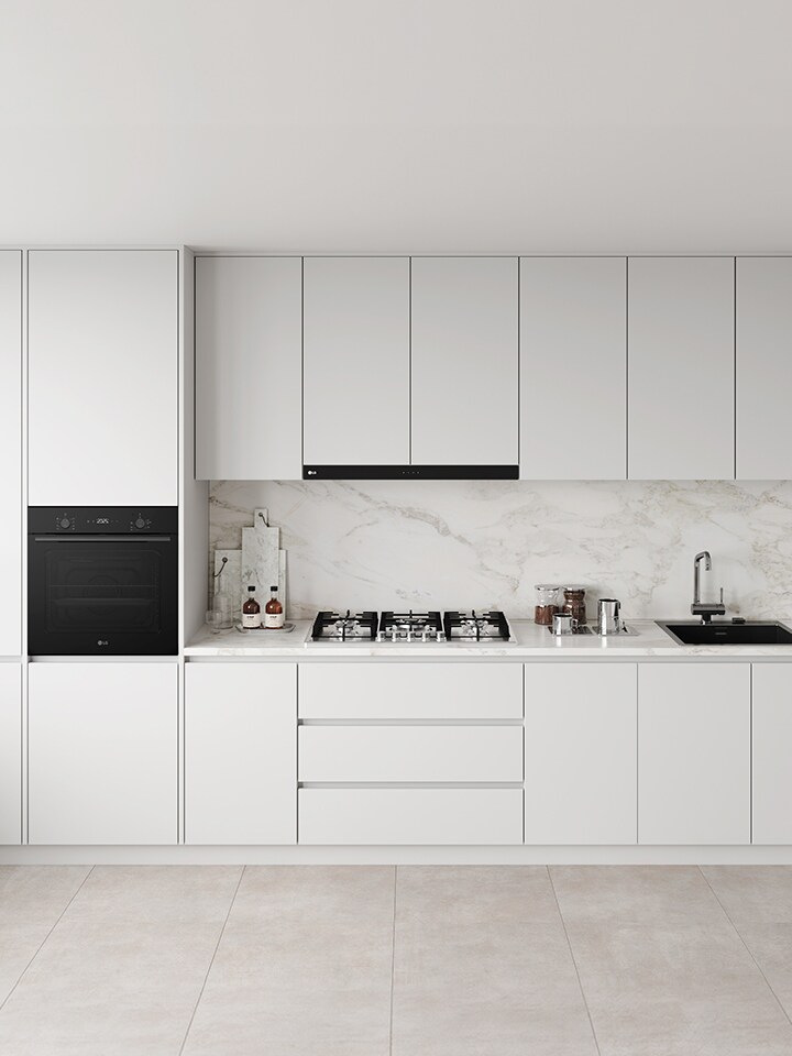 Modern kitchen with built-in black gas cooktop, integrated oven, and stainless steel sink.