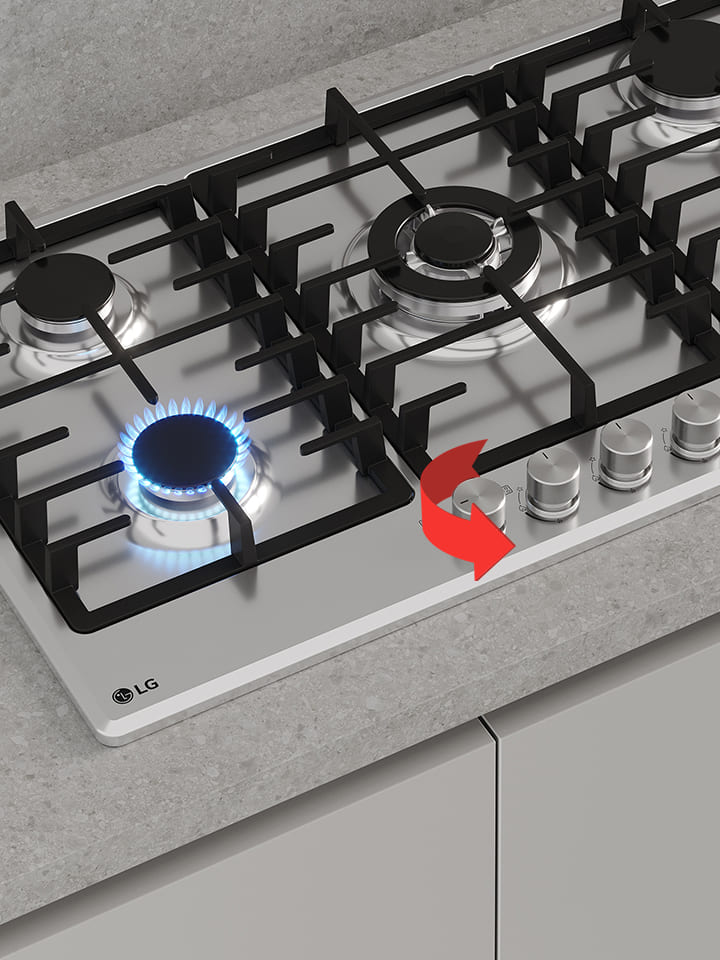 Close-up of black gas cooktop with blue flame burner and front rotary knobs for precise heat control adjustment.
