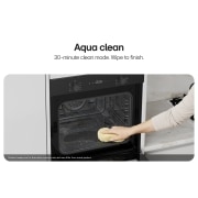 LG Built-In 60cm Electric Oven, 61L Capacity with Air Fry Function, Hand cleaning the interior of a built-in oven with a sponge., WS5D6010G, thumbnail 6