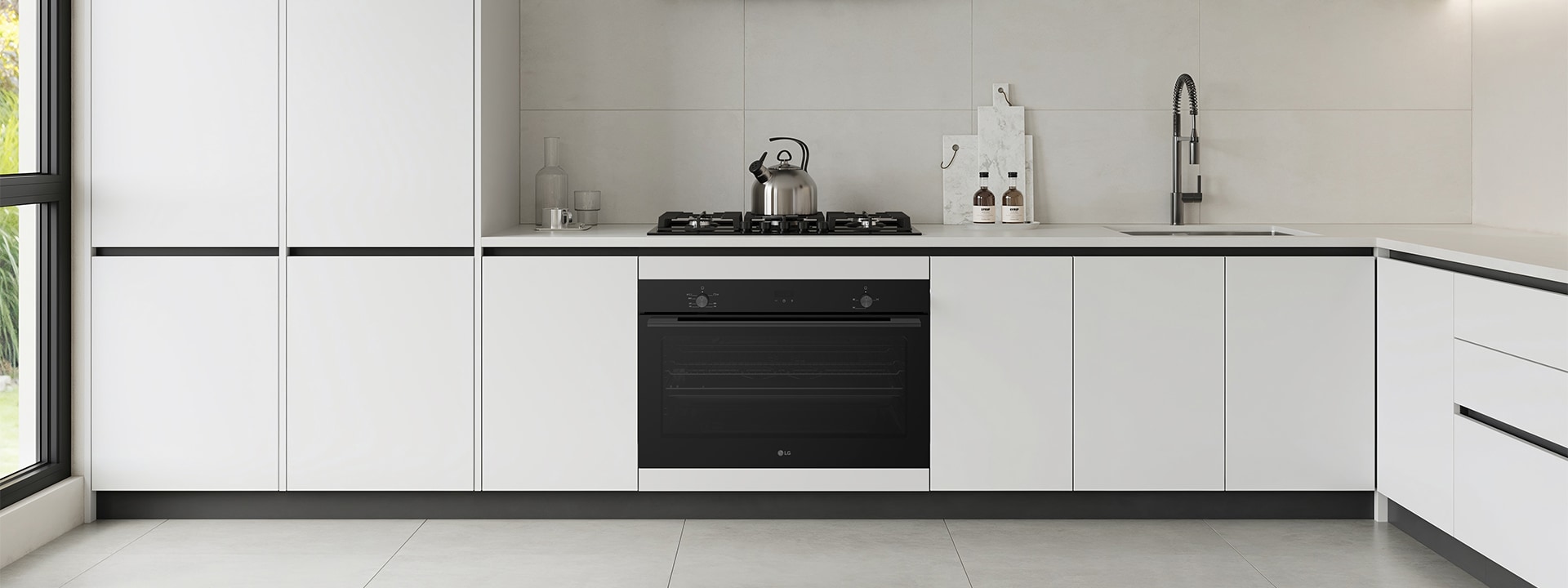 Modern kitchen with built-in black wall oven and gas cooktop.