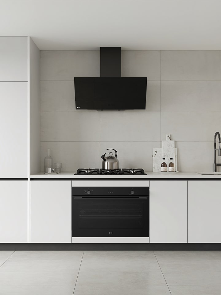 Modern kitchen with built-in black wall oven and gas cooktop.