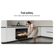 LG 90cm Built-In Gas Oven, 52L Capacity with Air Fry Function, Woman placing a tray of baked pastries into a built-in oven., WSG5D9611G, thumbnail 7