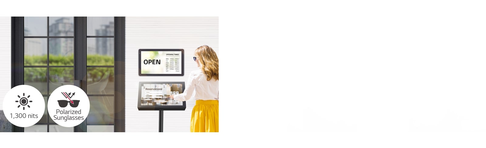A 22XF1TJ is installed on the wall at the entrance of the building with another 22XF1TJ stand below for reservation purposes. The lady with sunglasses is using the touchscreen to make a reservation. The screen remains visible even when under direct sunlight.