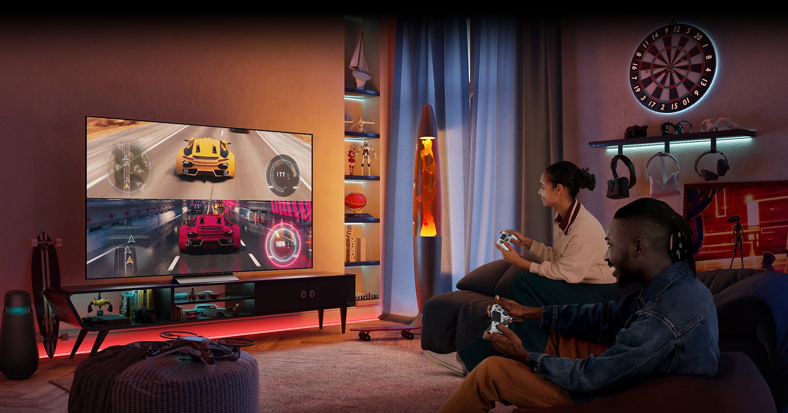 Men and women are sitting on the sofa and enjoying racing games together on TV.