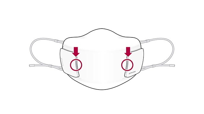 A video shows the front view of the mask with two circles on the filter. Two arrows appear and point down at the circles and then the arrows disappear and reappear and point from the side out. Then the filter opens out and then disappear and new filters are lying down. The mask disappears and the filters are still 