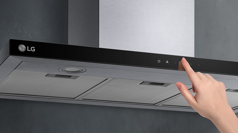 This is an image of touching the touch control of the hood with a finger.