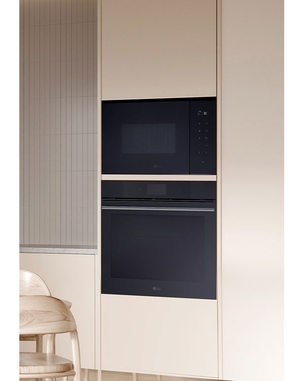 The Built- in microwave oven which is installed on the wall with the oven.