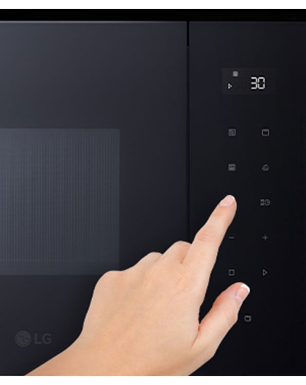 The Touch panel of Built-in microwave oven and the touching finger.