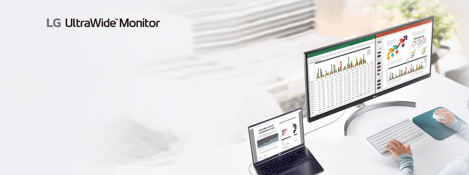 Image of LG UltraWide™ Monitor product connected to the laptop placing on the white desk and displaying datasheets and slides side by side on the screen
