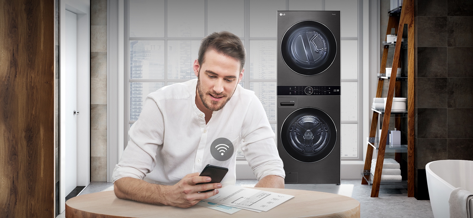 A man is monitoring the condition of the washing machine through a mobile phone app.