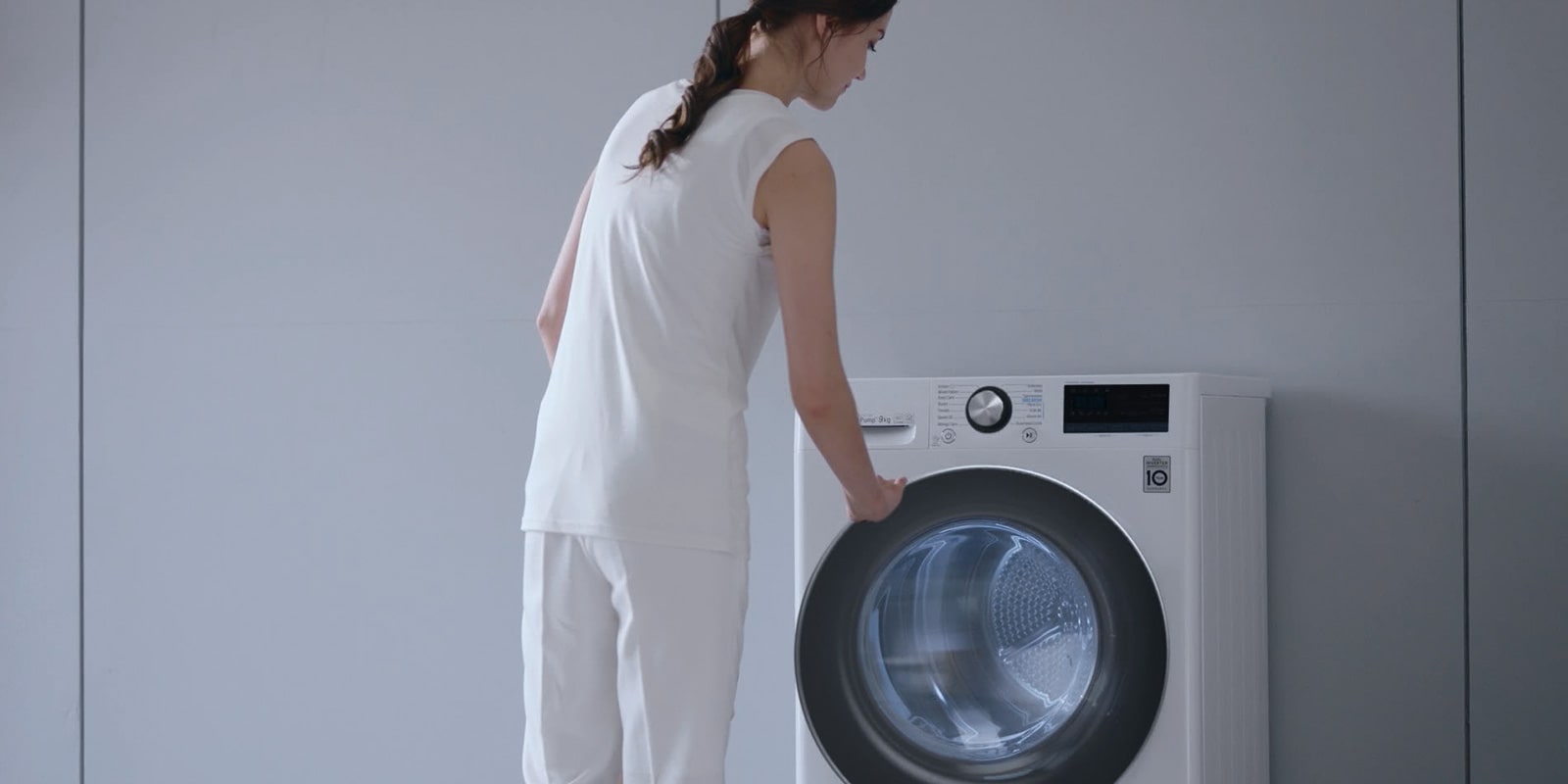 Woman standing in front of a LG dryer