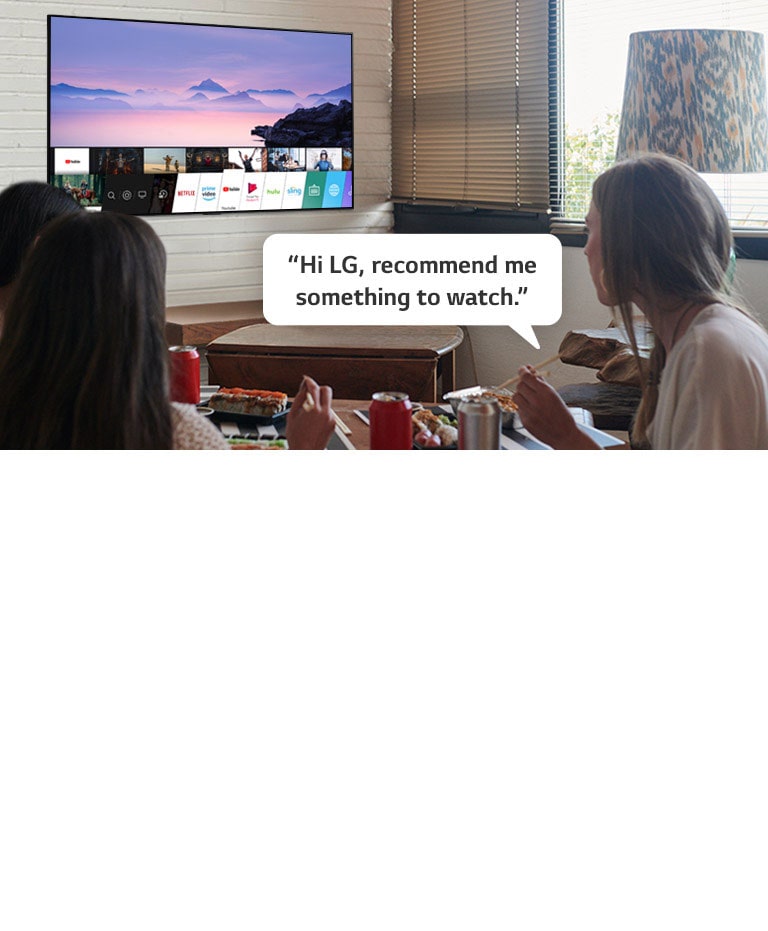 Three woman eating sushi while one of them asks LG TV recommendations to watch