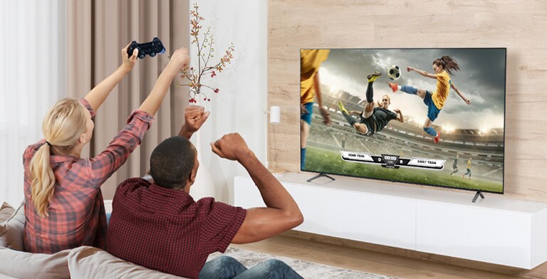 The man and woman are playing games, and the game's scene shown on the TV screen is realistically expressed.