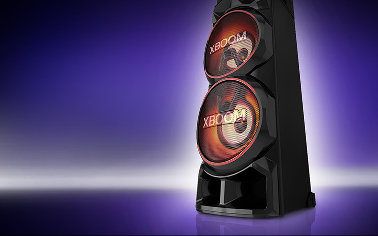 A low angle view of the right side of LG XBOOM against a purple background. The XBOOM lights are red.
