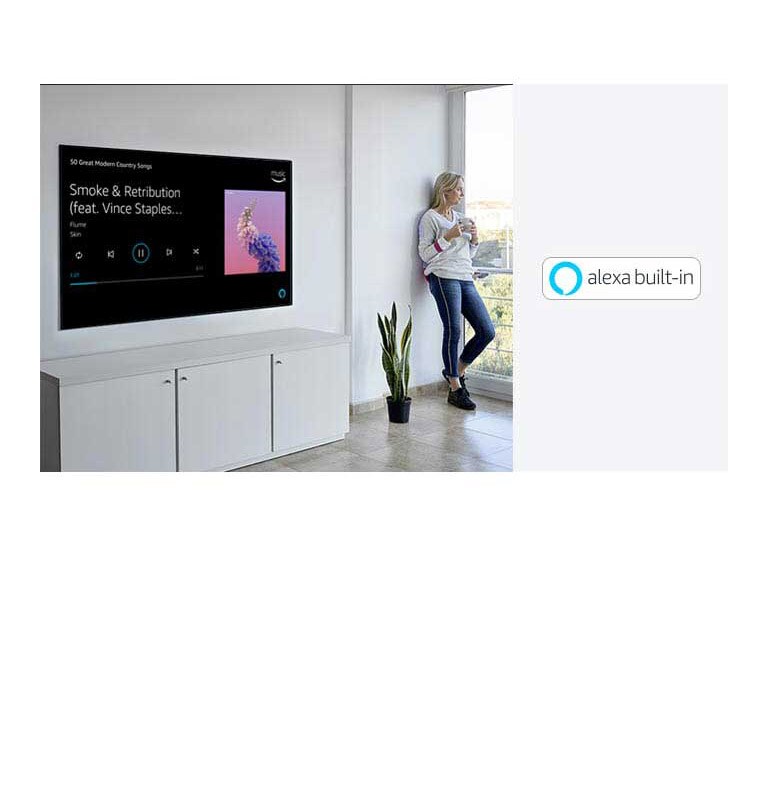 A woman is leaning beside TV, looking out the window and ask alexa