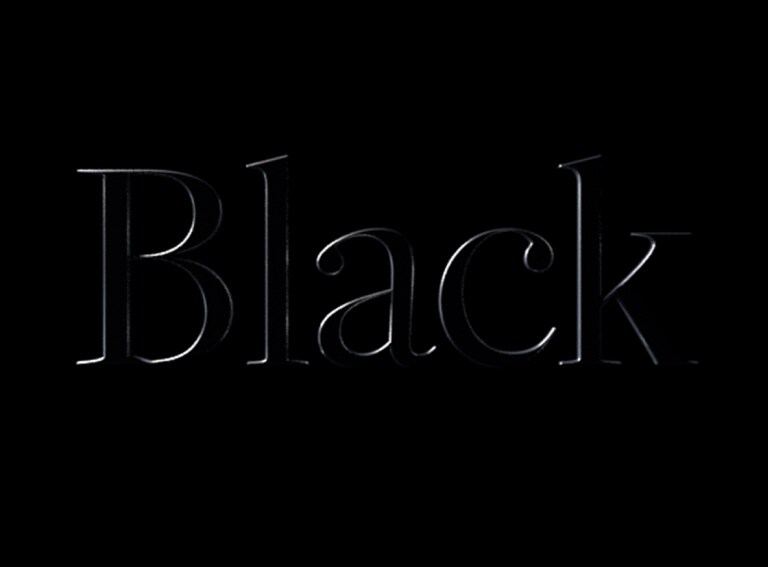 Word black embossed on a black background. 