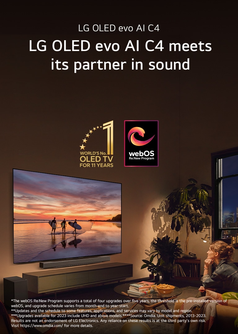 LG OLED evo AI C4 TV mounted on the wall of a cosy evening living room and an LG soundbar mounted just below it. On the TV, a beach at sunset with silhouttes of three surfers is displayed. Two women sit on the sofa facing and leaning towards the TV and soundbar. The "World's number 1 OLED TV for 11 Years" emblem and the "webOS Re:New Program" logo are in the image. A disclaimer reads: "The webOS Re:New Program supports a total of four upgrades over five years, the threshold is the pre-installed version of webOS, and upgrade schedule varies from month-end to year-start." "Updates and the schedule to some features, applications, and services may vary by model and region."  "Upgrades available for 2023 include UHD and above models." "Source: Omdia. Unit shipments, 2013 to 2023. Results are not an endorsement of LG Electronics. Any reliance on these results is at the third party’s own risk. Visit https://www.omdia.com/ for more details."