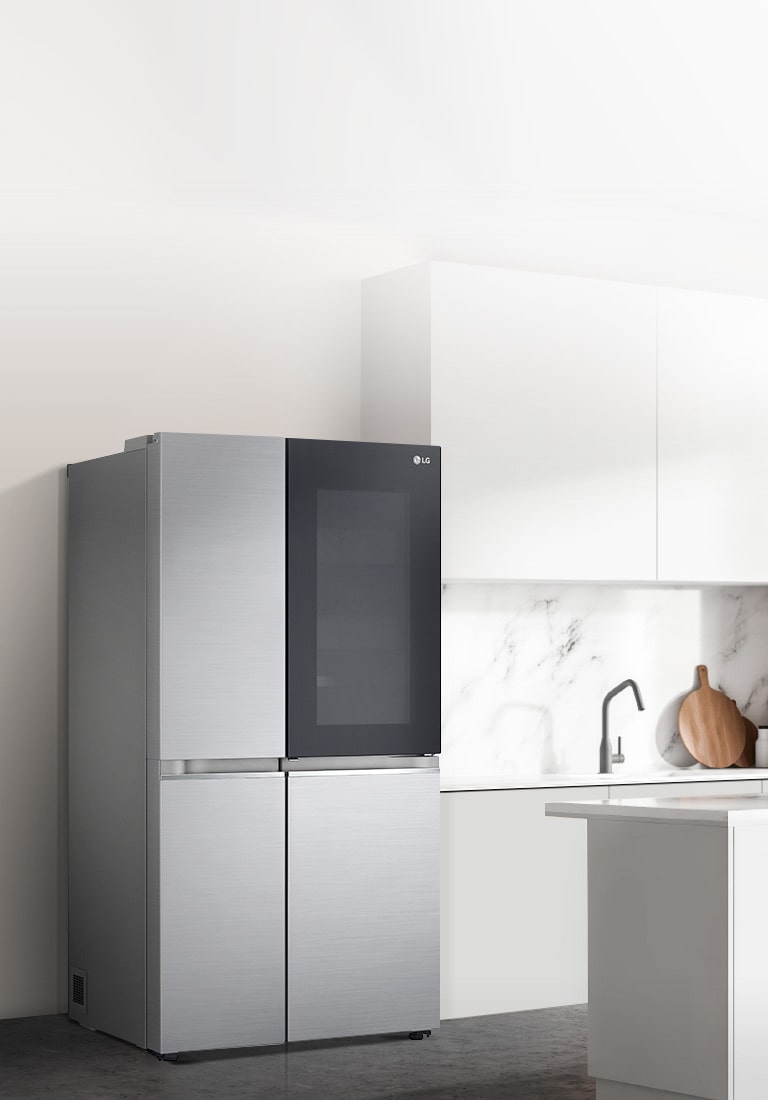 A side view of a kitchen with a black InstaView refrigerator installed.