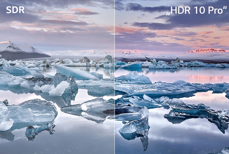 Paveikslėlyje vaizduojamas vyras, kuris dviejuose monitoriuose redaguoja draugų, sėdinčių prie laužavietės, nuotraukos spalvas.