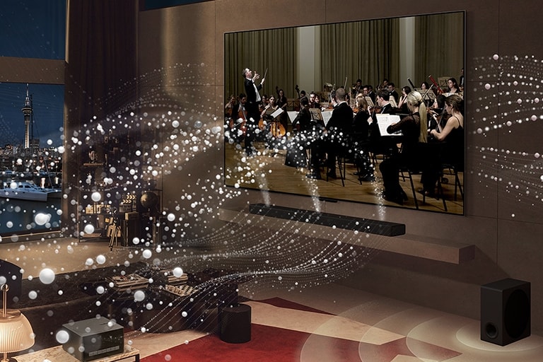 Ekrane rodomas koncertas, o iš LG SIGNATURE OLED M4 ir LG Soundbar po kambarį sklinda balti apskritimai. 