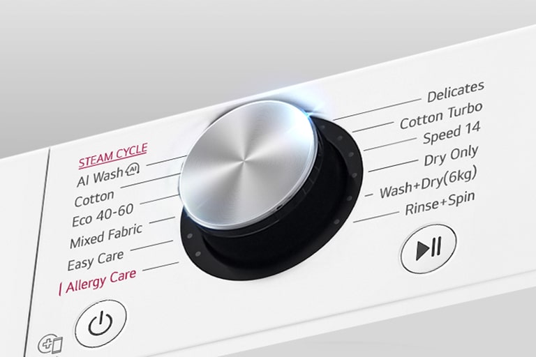 Išdidintas skalbyklės skydelio metalinės rankenėlės vaizdas.