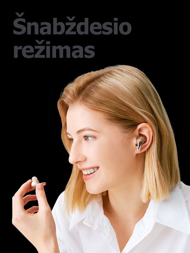 Atvaizdas su moterimi, kuri ausinuką laiko rankoje ir kalbasi telefonu šį ausinuką naudodama kaip mikrofoną.