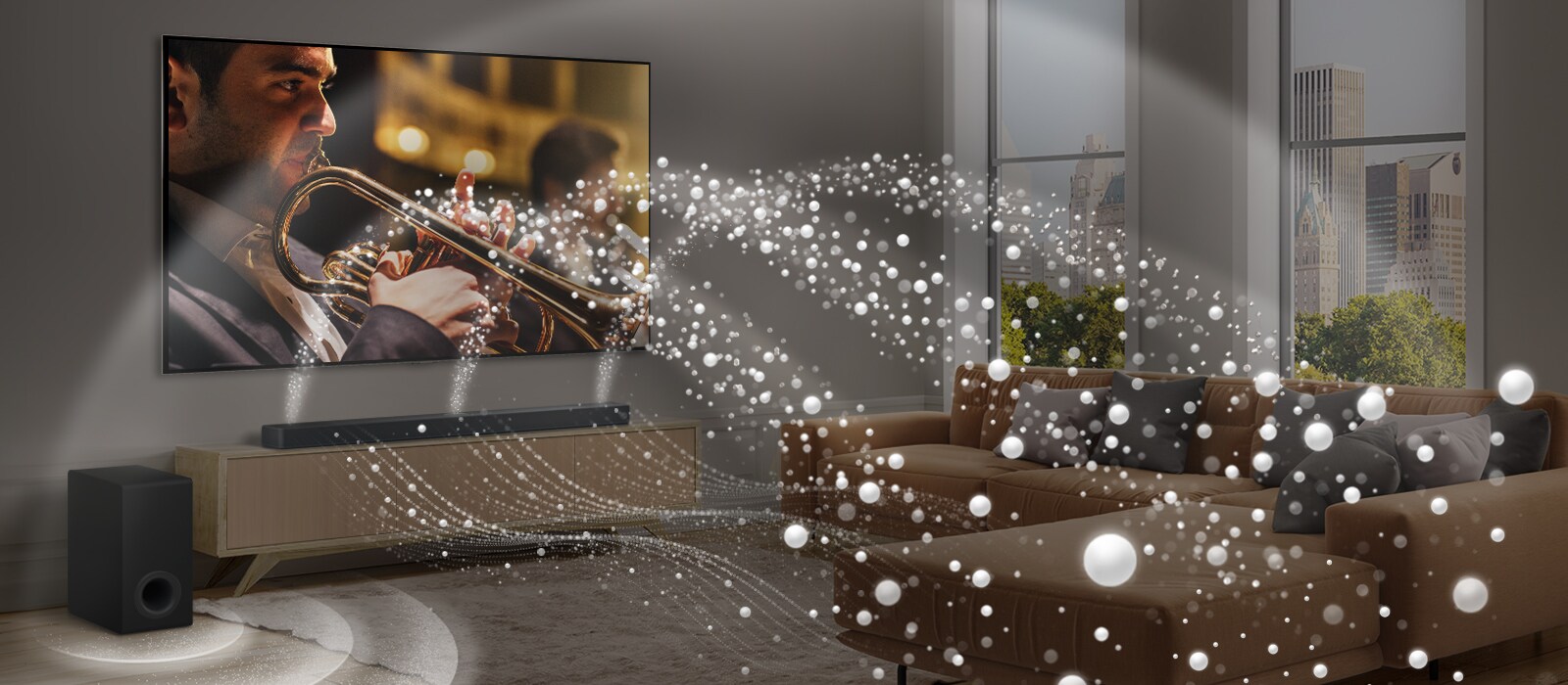 LG „Soundbar“, LG TV ir žemųjų dažnių garsiakalbis moderniame miesto bute. LG „Soundbar“ skleidžia garso bangas iš baltų lašelių, kurios užpildo kambarį, o žemųjų dažnių garsiakalbis sukuria garso efektą iš apačios. Bendrai sistema sukuria garso kupolo efektą.