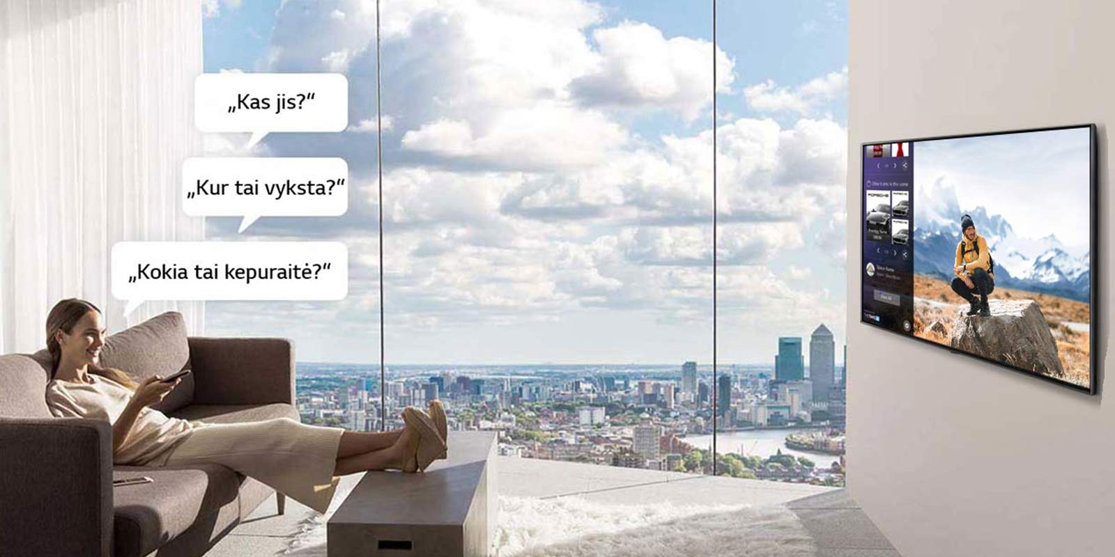 Televizorių žiūrinti moteris ir jo klausianti „Kas jis?“, „Kur tai vyksta?“ ir „Kokia tai kepuraitė?“ 