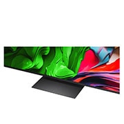 LG 86 colių LG QNED evo AI MiniLED 4K išmanusis TV QNED86 2025, Peizažo vaizdas, kuriame matomas urvas, o virš jo plyti giedras mėlynas dangus, perskirtas per vidurį – pusė vaizdo išblukusi, o kita pusė kontrastingai ryški. Apačioje kairėje pusėje yra nedidelis įp, 86QNED86A3A, thumbnail 7