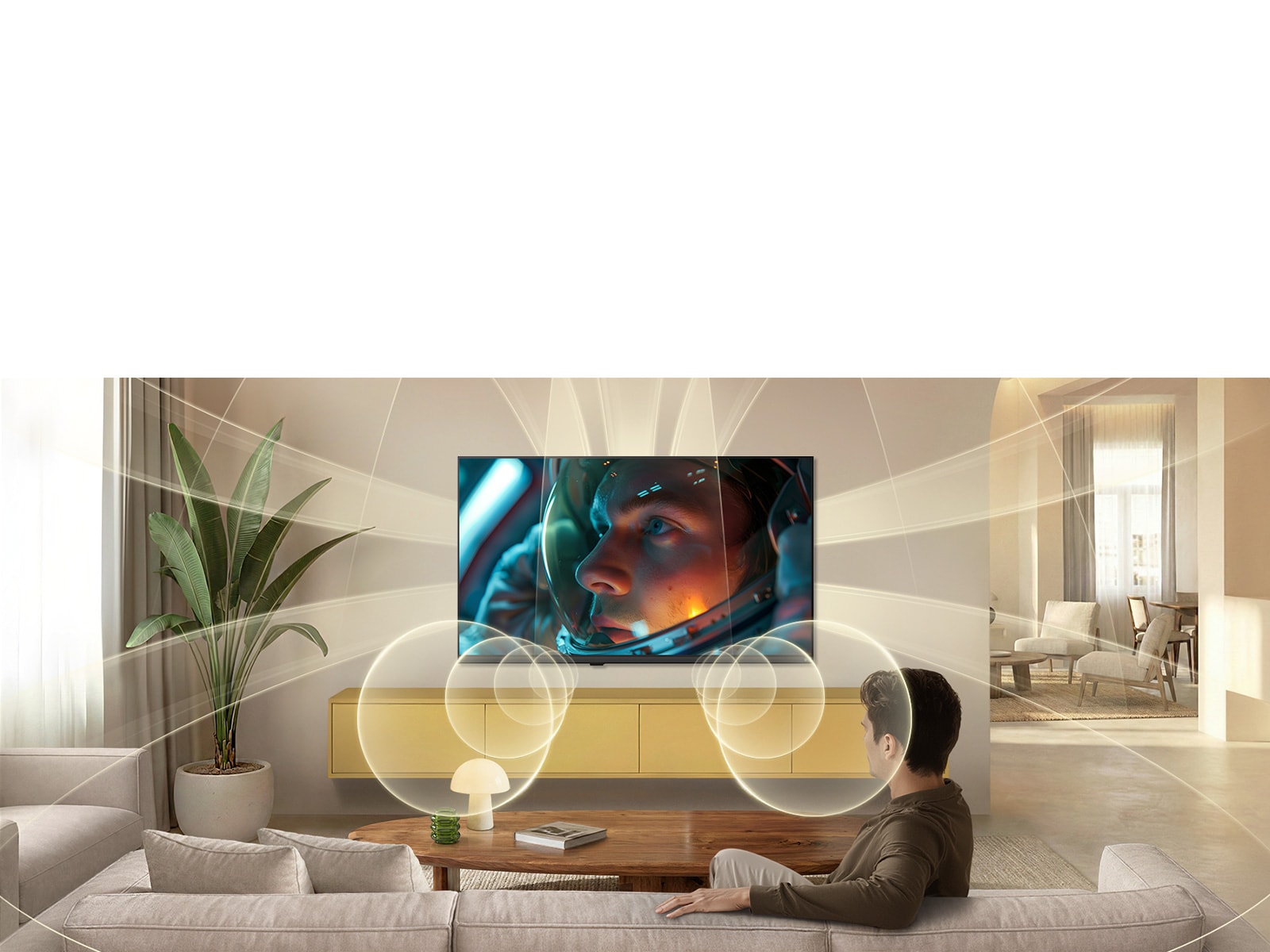 LG SMART TV AI LB70 FHD TV ar AI Sound virtuāliem 9.1.2 kanāliem piepilda modernu dzīvojamo telpu, kamēr ekrānā tiek rādīta astronauta filmas aina, apņemot istabu ar daudzvirzienu skaņu dziļam efektam.