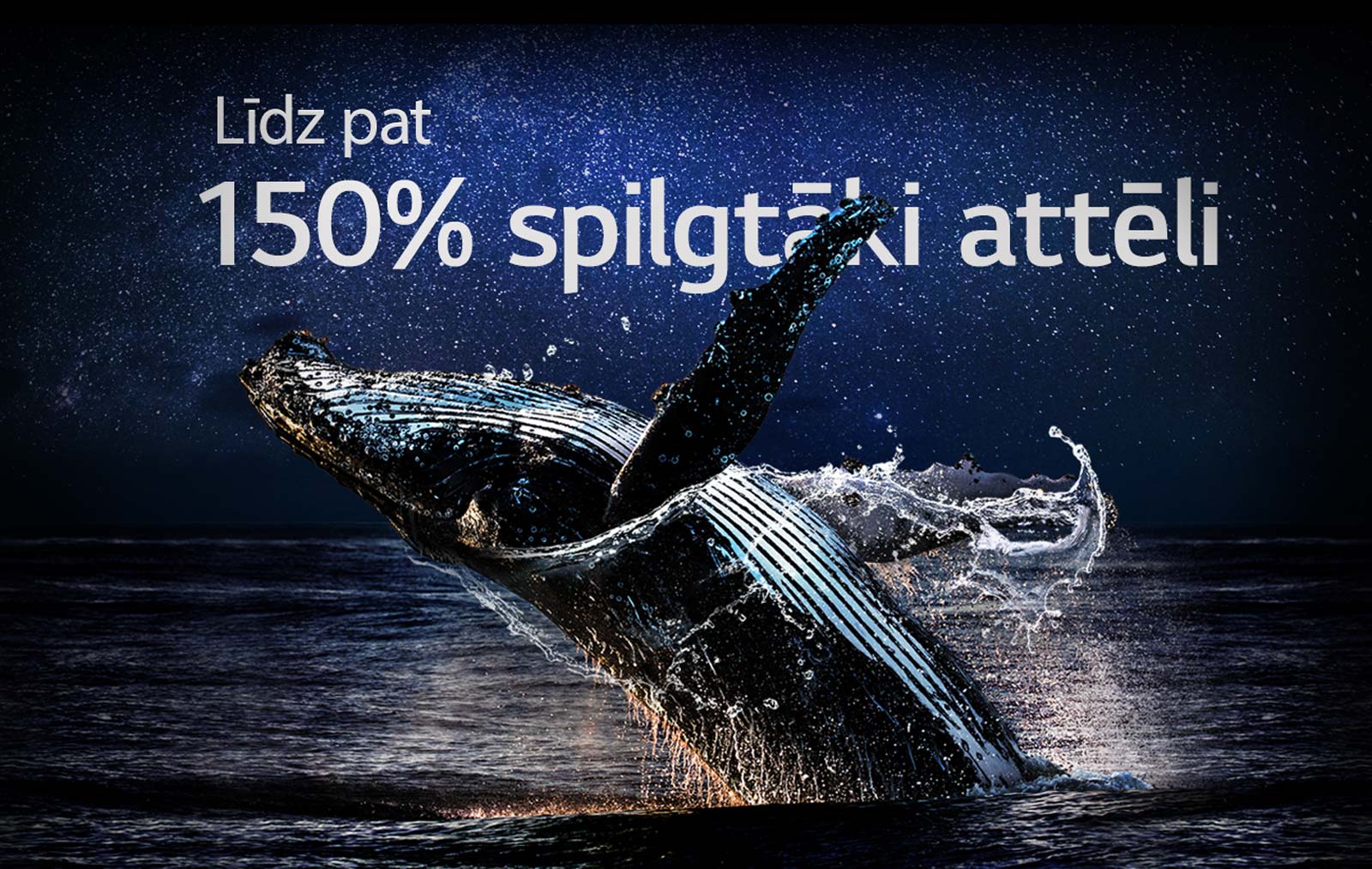 No okeāna izlec valis uz melna fona. Tiek parādīti vārdi "Līdz pat 150 % spilgtāk" virs vaļa, pastiprinoties spilgtumam.