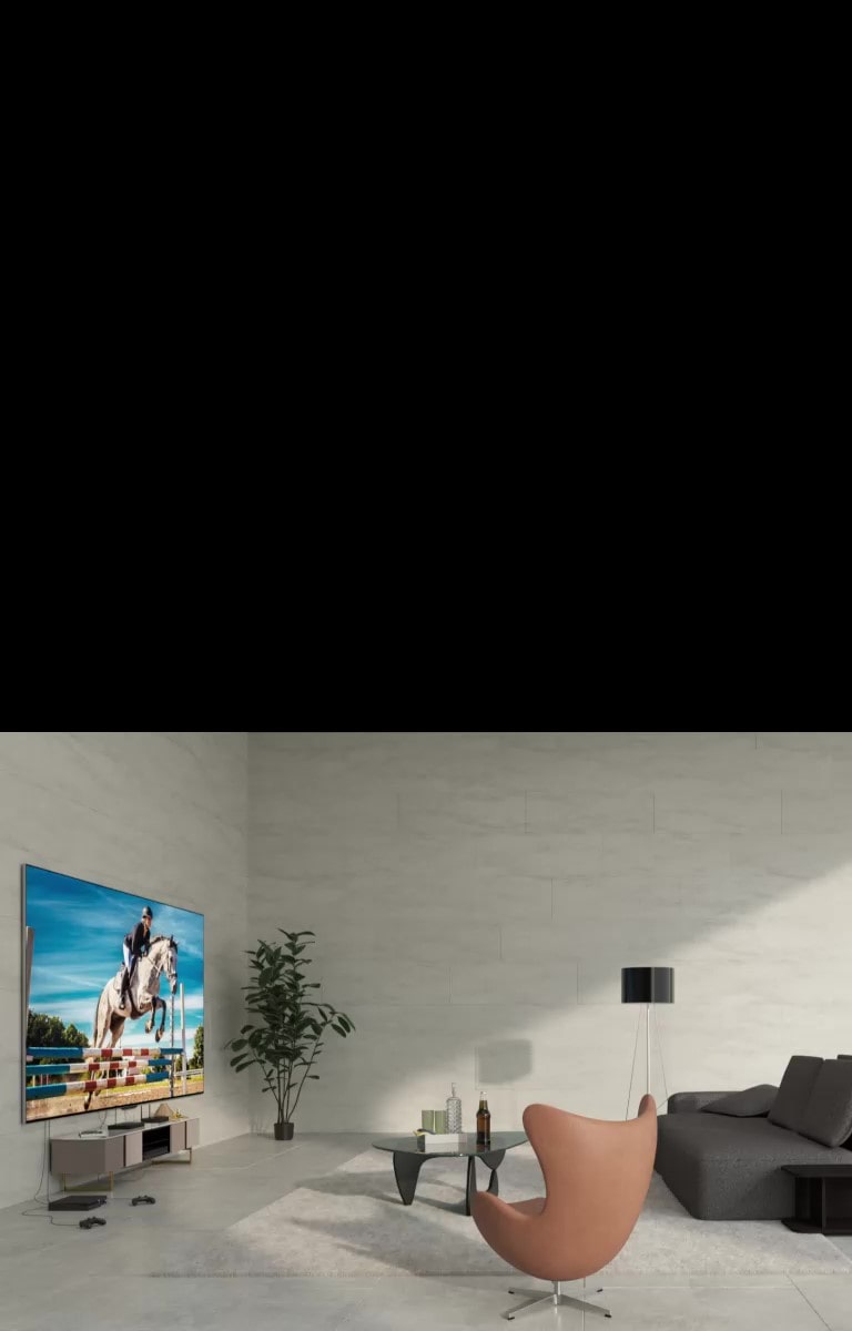 LG SIGNATURE OLED M4, kas uzstādīts uz sienas, un ierīces, kuras savienotas ar televizoru ar vadu jucekli zem tā. Balta grafiska līnija pāri attēlam, ierīces izbalo un uz neliela galda parādās Zero Connect Box. Attēls uz īsu brīdi kļūst tumšāks, un tiek iezīmēts tikai televizors un Zero Connect Box. Viss izgaist, pēc tam televizors un Zero Connect Box atkal parādās izcelti dažādās vietās, šoreiz LG SIGNATURE OLED M4 uz statīva. Attēls atkal kļūst gaišāks. Attēls kļūst tumšāks vēl vienu reizi, un, kad tas kļūst gaišāks, televizors tiek piestiprināts pie citas sienas.