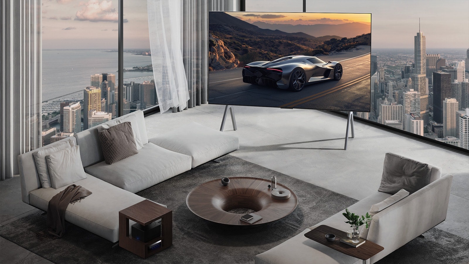 Plaša viesistaba ar skatu uz pilsētas ainavu. LG OLED TV ir novietots uz statīva. Ultra Slim dizains rada ekrānam iespaidīgu sajūtu.  Zero Connect Box ir redzams, bet paslēpts.