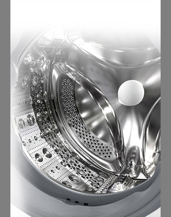 Attēls, kurā redzama veļas mazgājamās mašīnas iekšpuse ar nerūsējošām lāpstiņām.