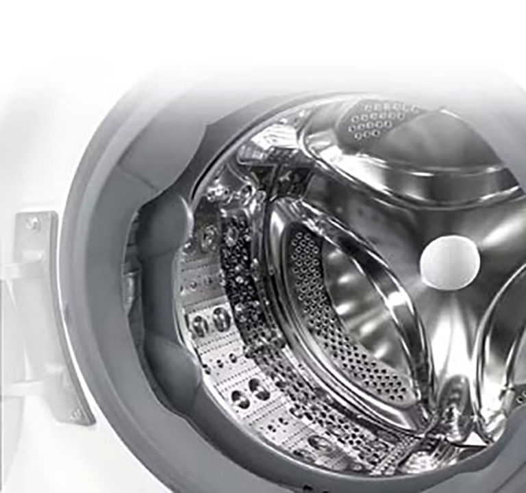 Attēls, kurā redzama veļas mazgājamās mašīnas iekšpuse ar nerūsējošām lāpstiņām.