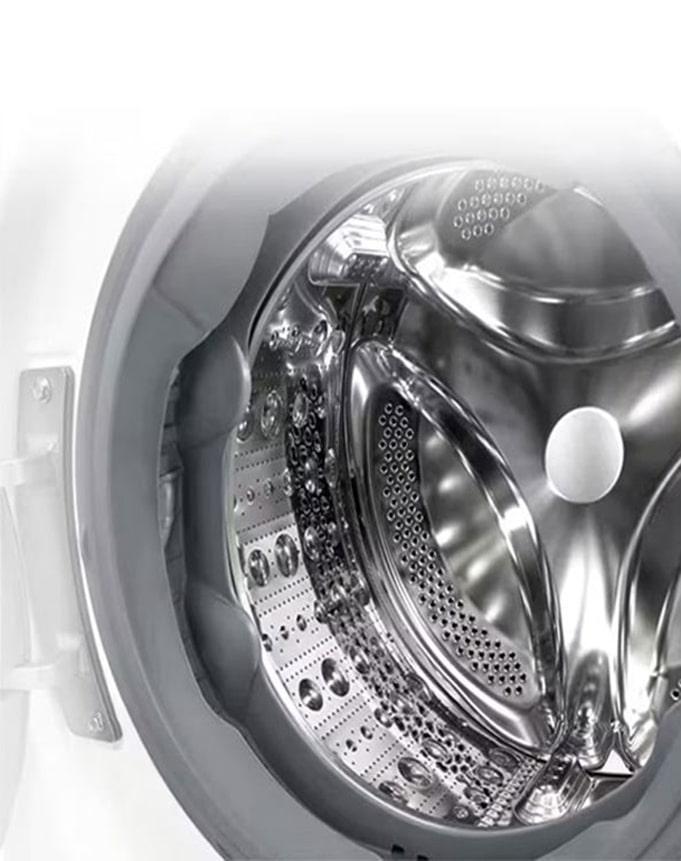 Attēls, kurā redzama veļas mazgājamās mašīnas iekšpuse ar nerūsējošām lāpstiņām.