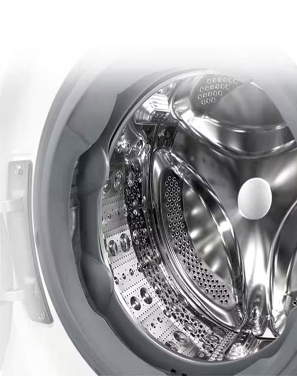 Attēls, kurā redzama veļas mazgājamās mašīnas iekšpuse ar nerūsējošām lāpstiņām.