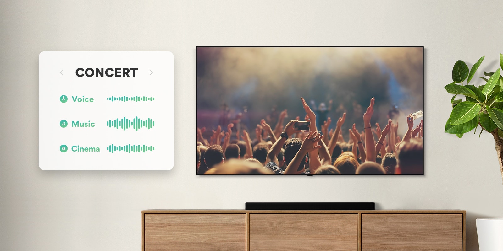 TV pie sienas. Televizorā redzami cilvēki, kas aplaudē koncertā, kanāls tiek pārslēgts uz filmu ainu ar pa mežu braucošu automašīnu, pēc tam kanāls tiek pārslēgts uz ziņām, un runā ziņu vadītājs. Tieši zem televizora uz smilškrāsas plaukta izvietota LG skaņas josla. (atskaņot video)