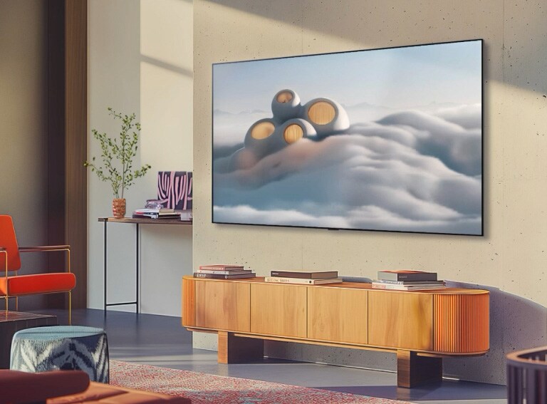 LG TV pie sienas ar augstas izšķirtspējas fonu.