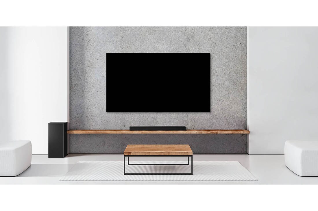 LG soundbar sistēma SPD7Y, Skaņas josla zem televizora baltā viesistabā, tieši blakus atrodas zemo frekvenču pastiprinātājs., SPD7Y, thumbnail 4