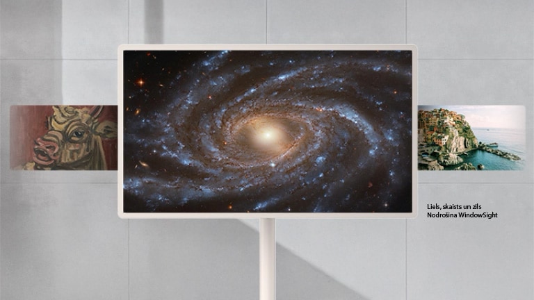 LG StanbyME 2 Max LX6 pārvietojamais ekrāns ar LG Gallery+ funkciju ekrānā attēlo WindowSight nodrošināto spirālveida galaktikas mākslas darbu “Big, Beautiful and Blue”, piedāvājot atlasītu mākslu, kas personalizē telpu ar galerijai līdzīgu klātbūtni.