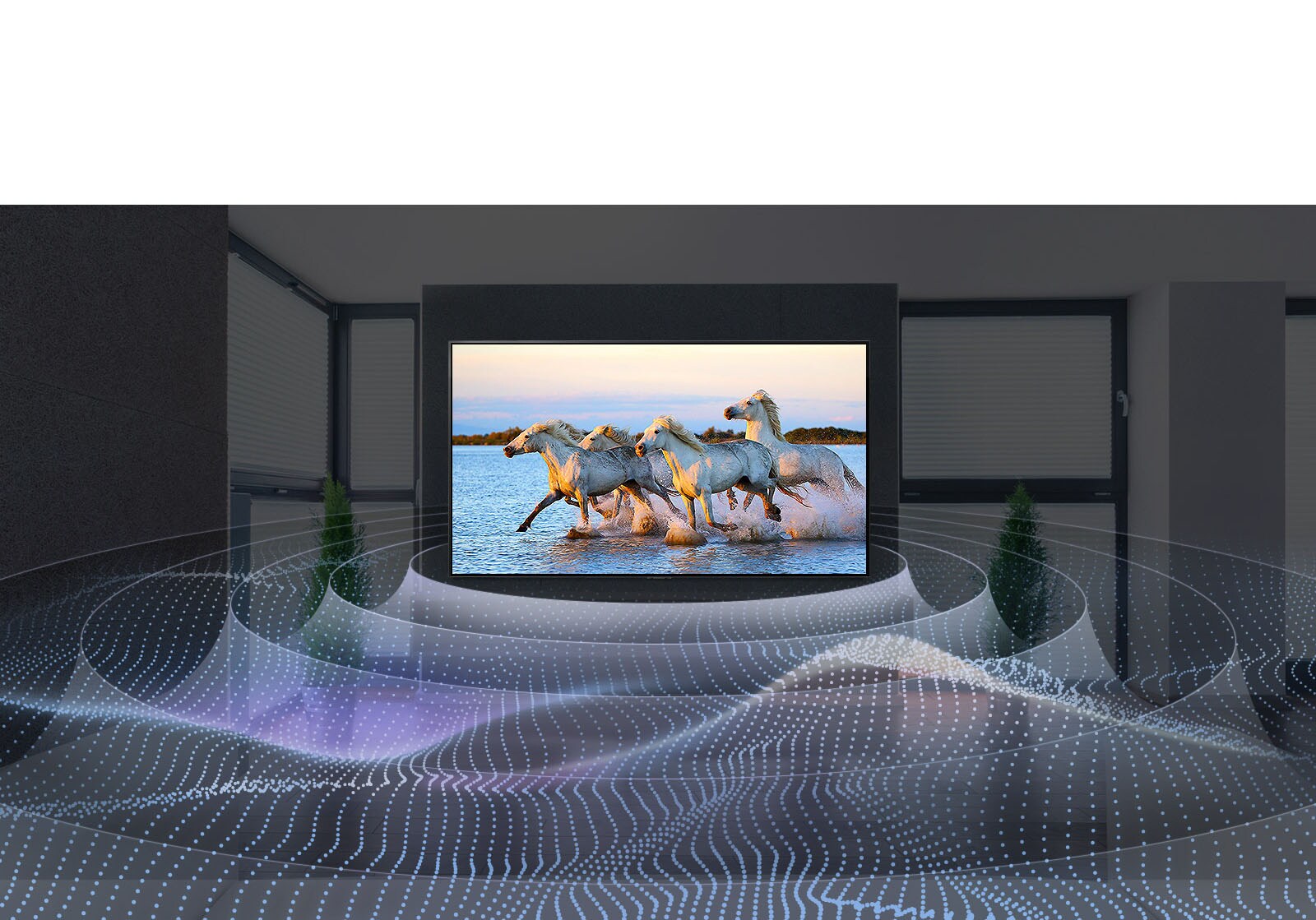 L’écran du téléviseur entouré d’ondes sonores affiche quatre chevaux blancs qui galopent dans l’eau.