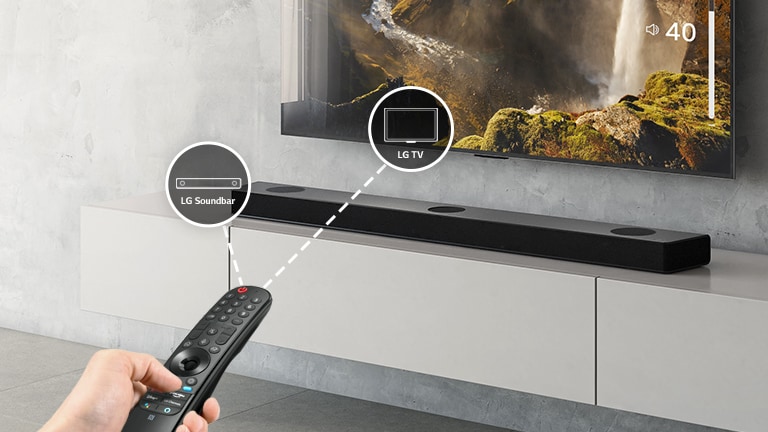 There is a LG remote control in someone's hand, controlling TV and sound bar at the same time. There are icons of LG TV and LG Sound bar. 