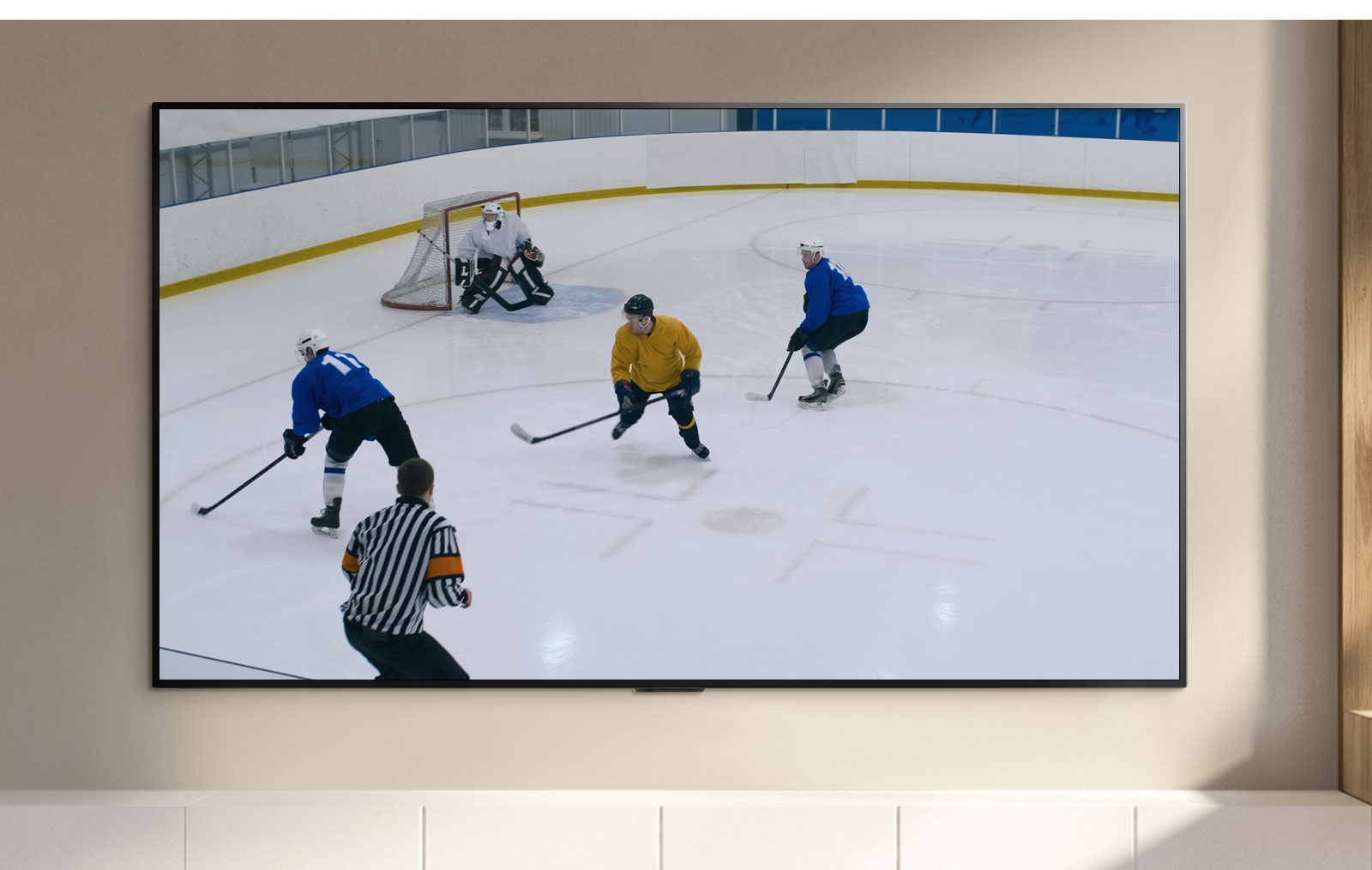A TV screen showing hockey players playing hockey(play the video)